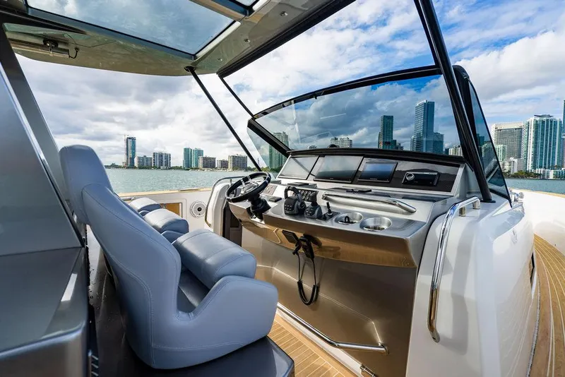 Slide: The Image of Luxurious 2022 Pardo Yachts 43 cockpit with city skyline view. - 7