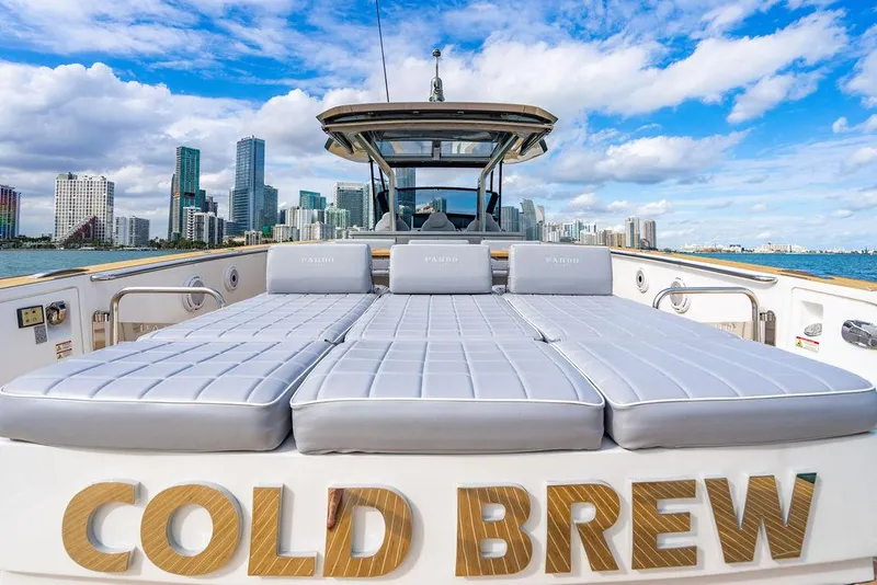 Slide: The Image of 2022 Pardo Yachts 43 with "Cold Brew" name, city skyline in background. - 14