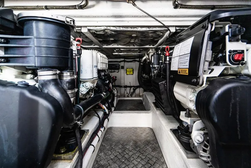 Slide: The Image of Engine room of 2022 Pardo Yachts 43, showcasing dual engines and mechanical components. - 27