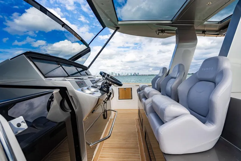 Slide: The Image of 2022 Pardo Yachts 43 interior with modern helm and luxurious seating, ocean view. - 9