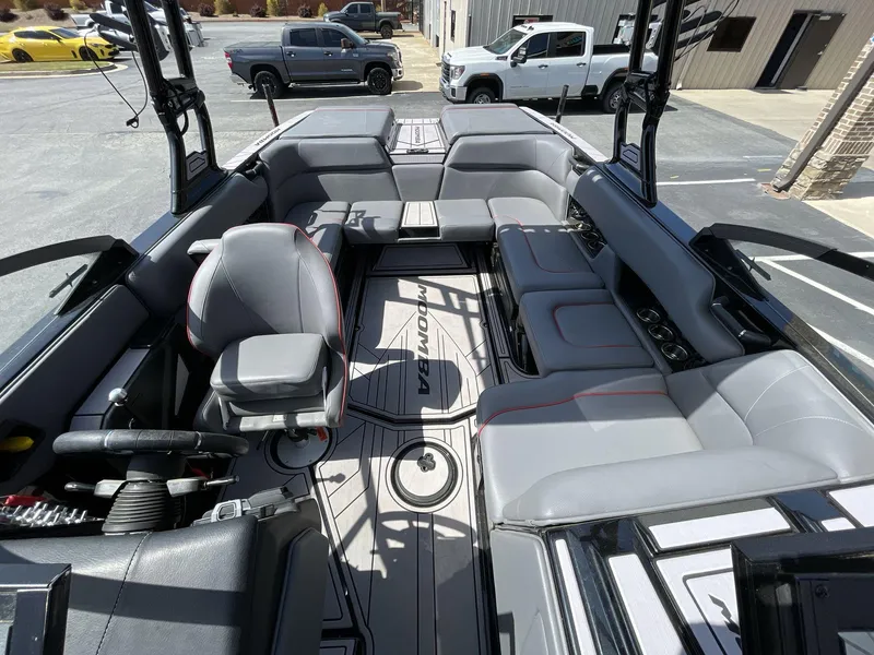 Slide: The Image of 2023 Moomba Craz boat interior with gray seating and modern design. - 27