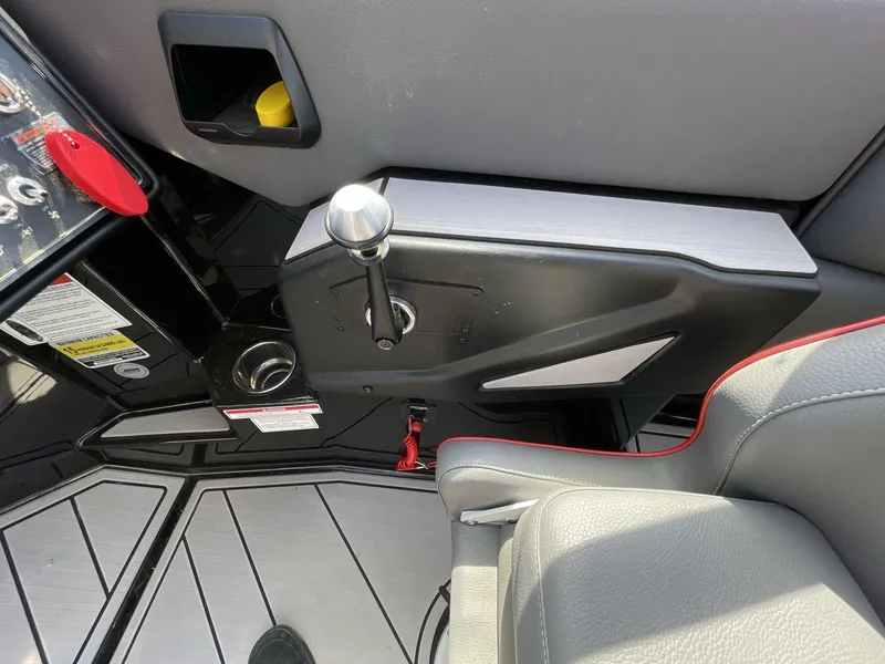 Slide: The Image of Interior of 2023 Moomba Craz boat, featuring control panel and seating area. - 33