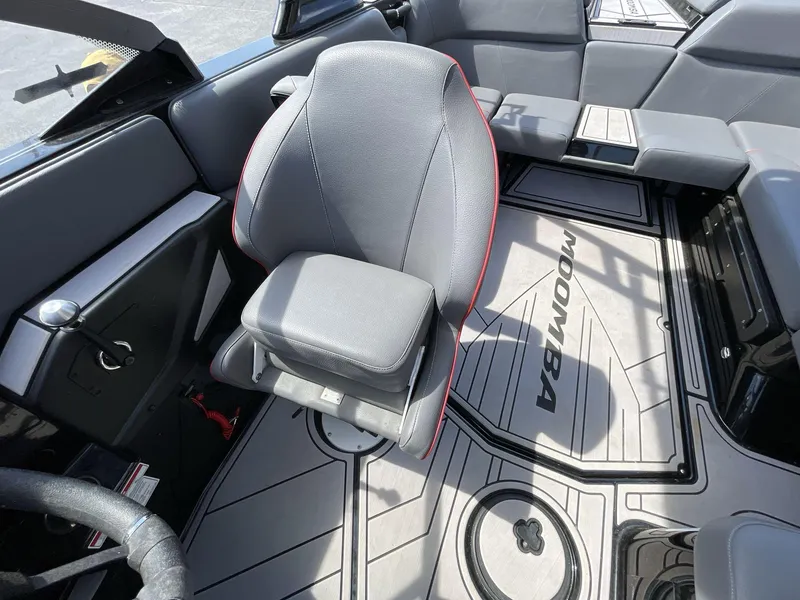 Slide: The Image of 2023 Moomba Craz interior with gray seating and branded flooring. - 35