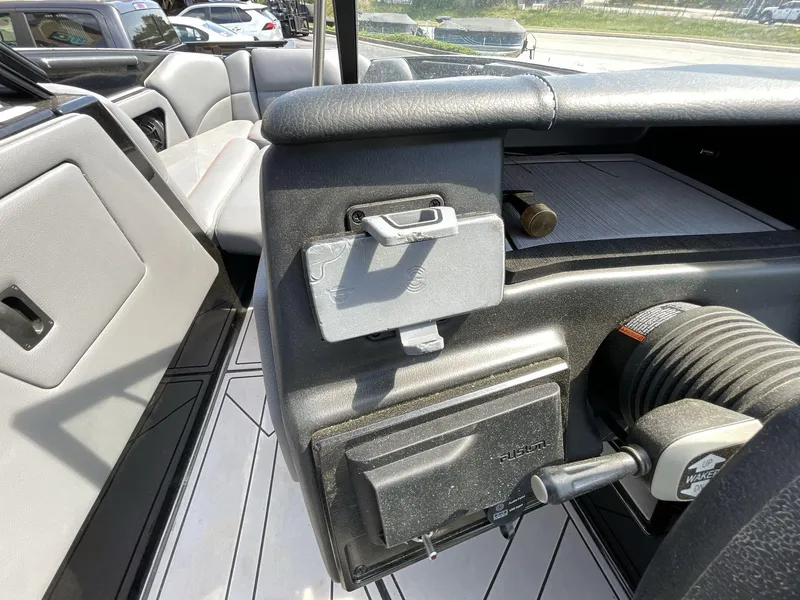 Slide: The Image of 2023 Moomba Craz interior, featuring seating and control panel details. - 36