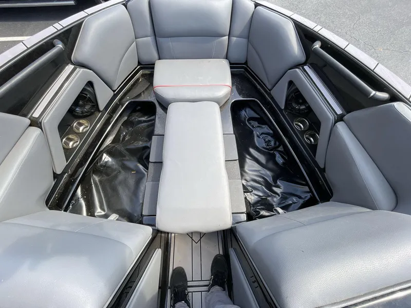 Slide: The Image of 2023 Moomba Craz boat interior with gray seating and cup holders. - 38