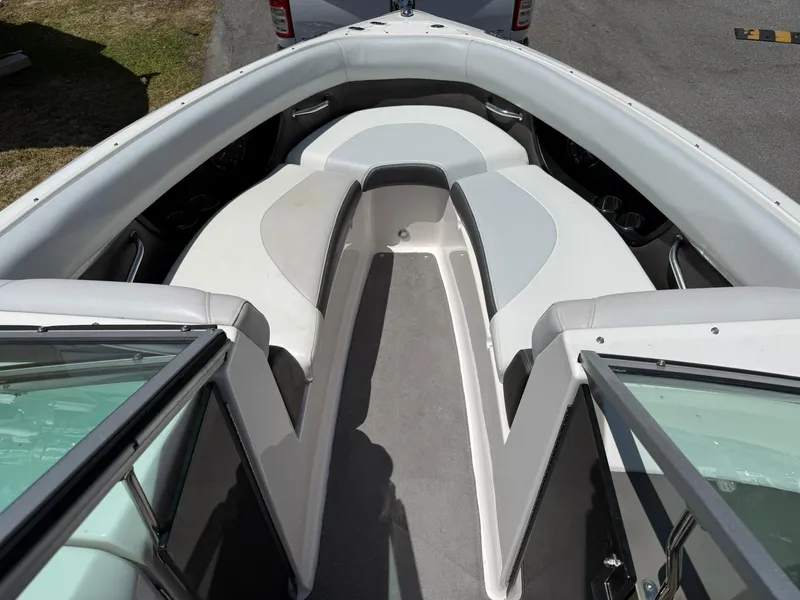 Slide: The Image of 2011 Regal 2500 Bowrider interior with spacious seating and sleek design. - 18