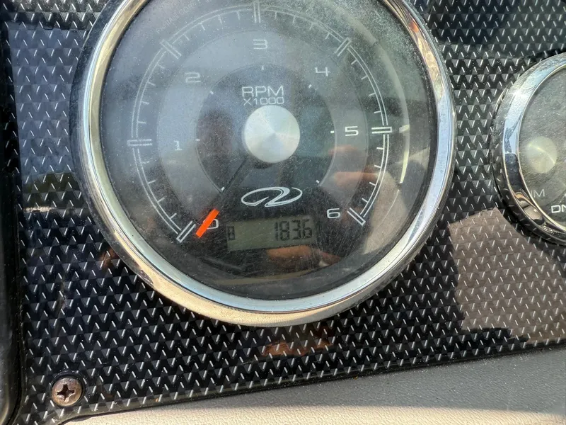 Slide: The Image of Close-up of 2011 Regal 2500 Bowrider RPM gauge displaying 1836 hours. - 26