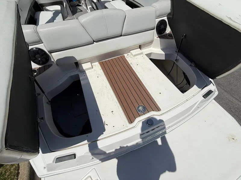 Slide: The Image of 2011 Regal 2500 Bowrider boat interior with seating and storage compartments. - 37
