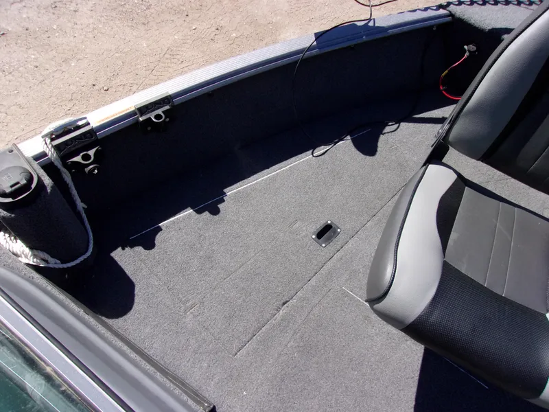 Slide: The Image of 2017 Lund 1775 Impact Sport boat interior with seating and carpeted floor. - 12