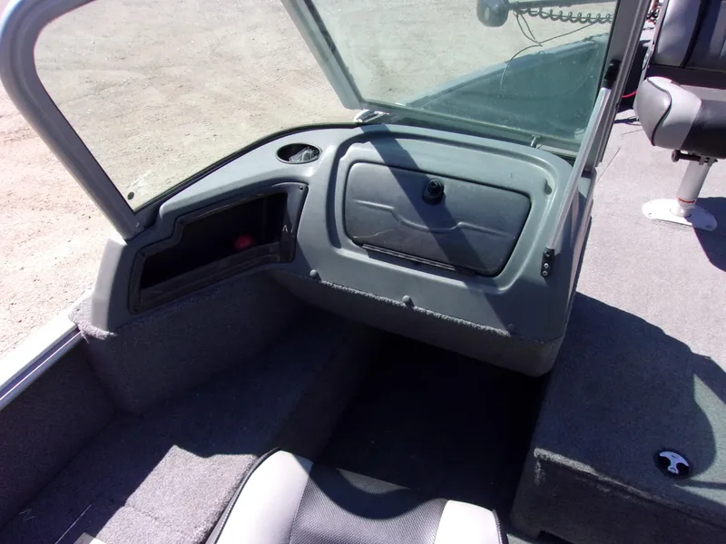 Slide: The Image of 2017 Lund 1775 Impact Sport boat interior with open windshield and seating area. - 6