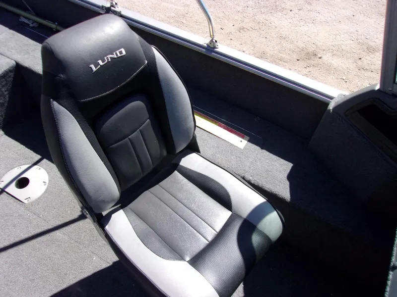 Slide: The Image of 2017 Lund 1775 Impact Sport boat seat, black and gray upholstery, interior view. - 7