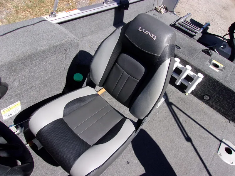 Slide: The Image of 2017 Lund 1775 Impact Sport boat seat, black and gray upholstery, interior view. - 8