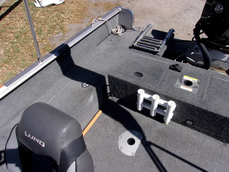 Slide: The Image of 2017 Lund 1775 Impact Sport boat interior with seating and storage compartments. - 9