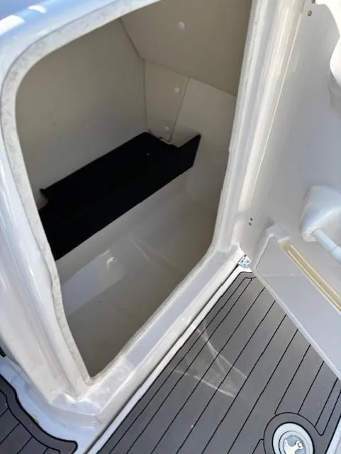 Slide: The Image of Storage compartment on 2016 Yamaha Boats 242 Limited S with non-slip flooring. - 10