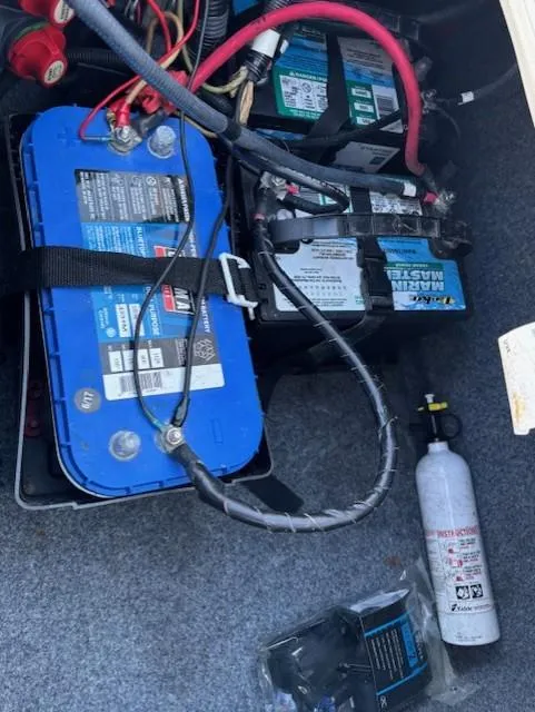 Slide: The Image of Battery compartment of a 2016 Yamaha Boats 242 Limited S with fire extinguisher. - 12