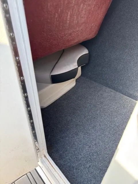 Slide: The Image of Interior view of 2016 Yamaha Boats 242 Limited S, featuring carpeted flooring and seating. - 16