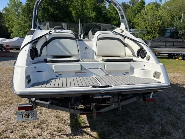 Slide: The Image of 2016 Yamaha Boats 242 Limited S, rear view, on trailer, in outdoor setting. - 3