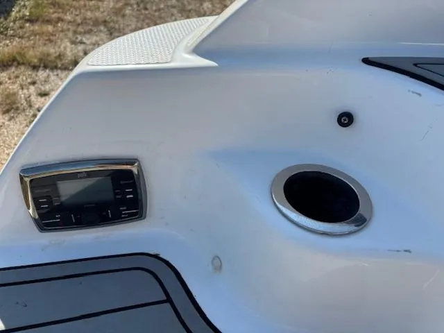 Slide: The Image of 2016 Yamaha Boats 242 Limited S dashboard with control panel and cup holder. - 5