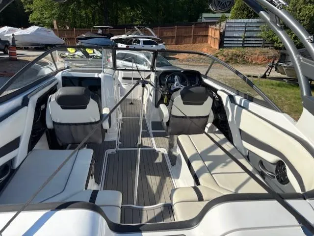 Slide: The Image of 2016 Yamaha Boats 242 Limited S interior with sleek seating and modern dashboard. - 7