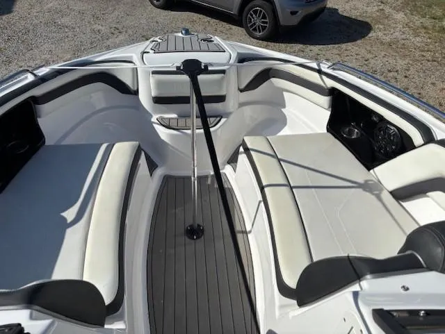 Slide: The Image of 2016 Yamaha Boats 242 Limited S interior with white seating and sleek design. - 8