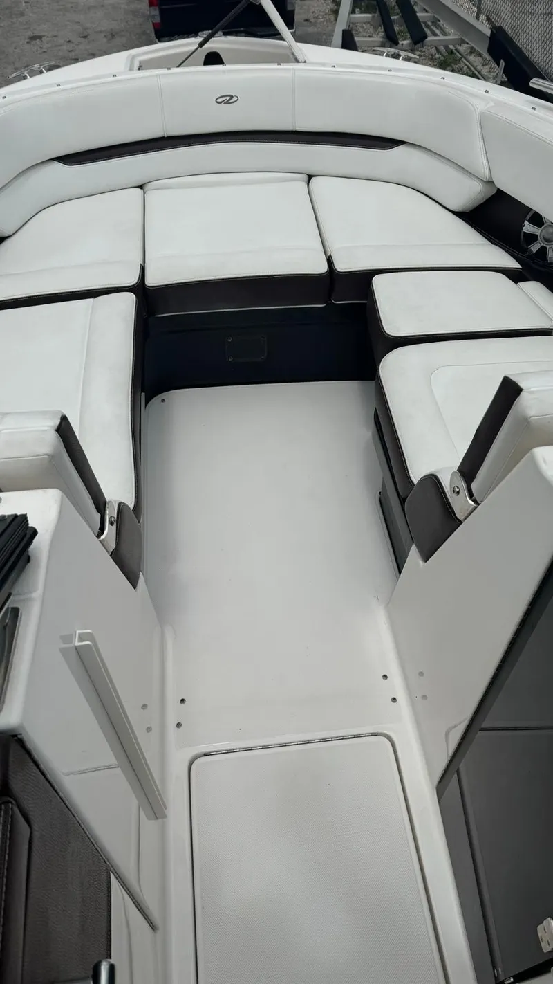 Slide: The Image of 2017 Regal 29 OBX boat interior with white cushioned seating. - 4