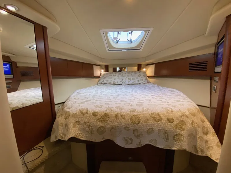 Slide: The Image of Luxurious cabin interior of 2007 Sea Ray 40 Sundancer yacht with cozy bedding. - 12