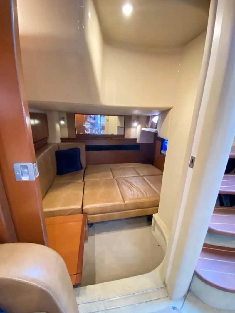 Slide: The Image of 2007 Sea Ray 40 Sundancer cabin interior with cozy seating and modern design. - 16