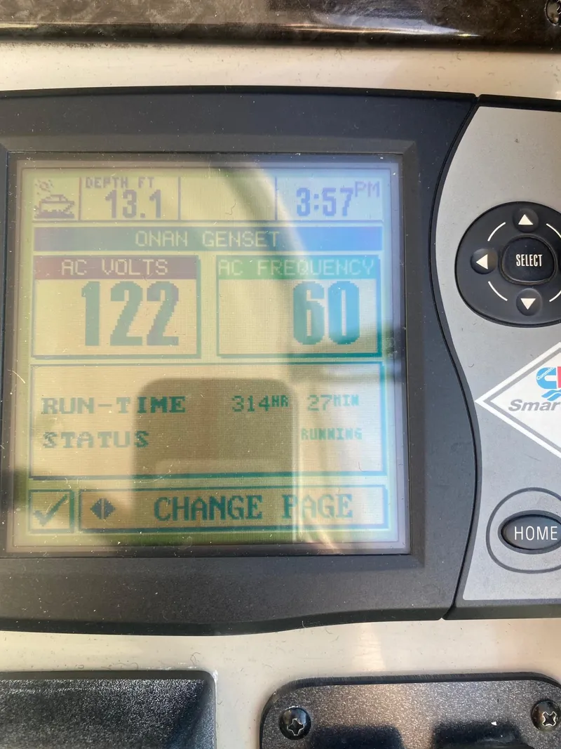 Slide: The Image of Control panel display on a 2007 Sea Ray 40 Sundancer showing voltage and frequency. - 5