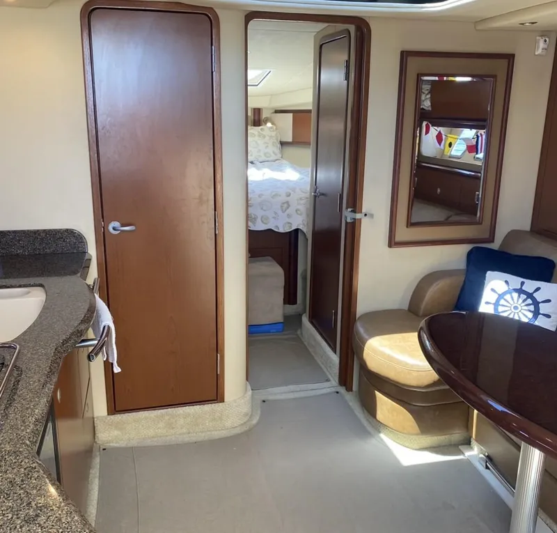 Slide: The Image of Interior of 2007 Sea Ray 40 Sundancer yacht with cozy seating and modern amenities. - 8