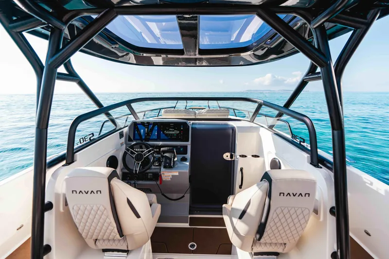 Slide: The Image of 2025 Navan S30 boat interior with modern dashboard and ocean view. - 11