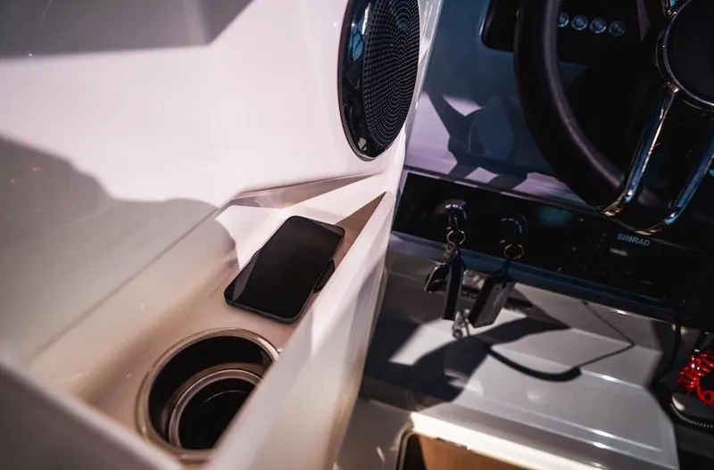 Slide: The Image of Interior of 2025 Navan S30 boat with phone holder and steering wheel. - 15