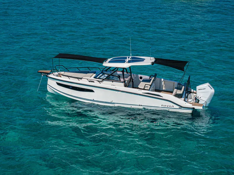 Slide: The Image of Navan S30 2025 boat cruising on clear blue water, featuring sleek design and modern amenities. - 4