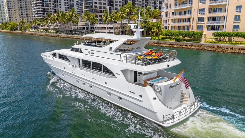 Slide: The Image of Luxury 2001 Intermarine RPH 95 yacht cruising near waterfront buildings. - 1