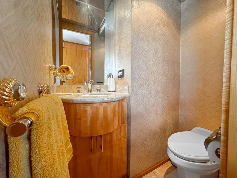 Slide: The Image of Luxurious bathroom in 2001 Intermarine RPH 95 yacht with elegant fixtures and warm decor. - 14