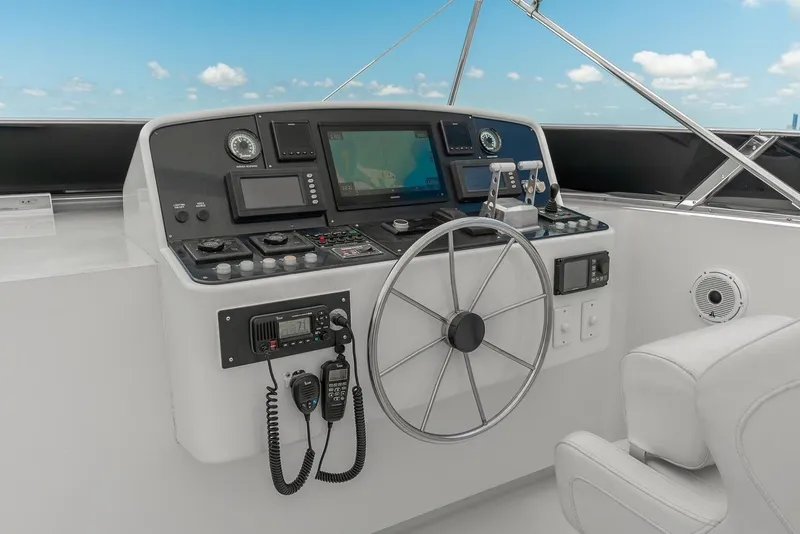 Slide: The Image of Helm of 2001 Intermarine RPH 95 yacht with navigation equipment and steering wheel. - 18