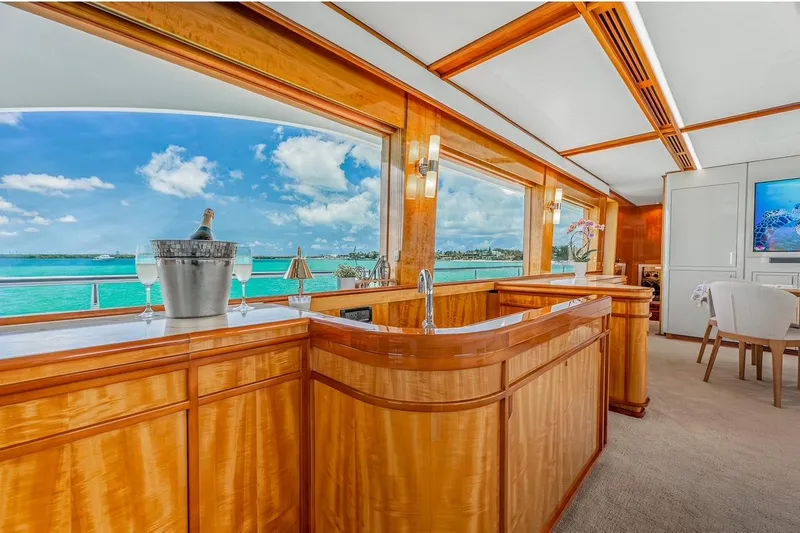 Slide: The Image of Luxurious interior of 2001 Intermarine RPH 95 yacht with ocean view and elegant wood finishes. - 21