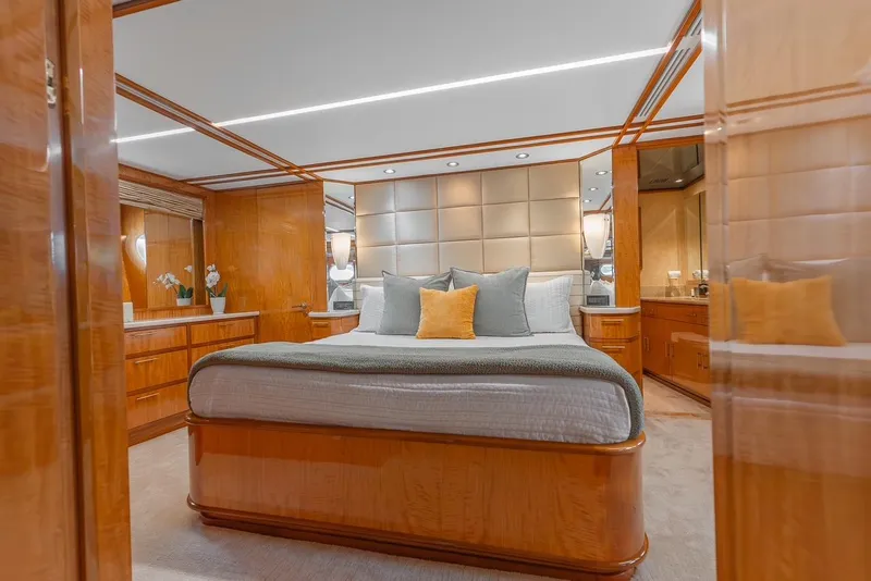 Slide: The Image of Luxurious bedroom interior on 2001 Intermarine RPH 95 yacht with elegant wood finishes. - 26