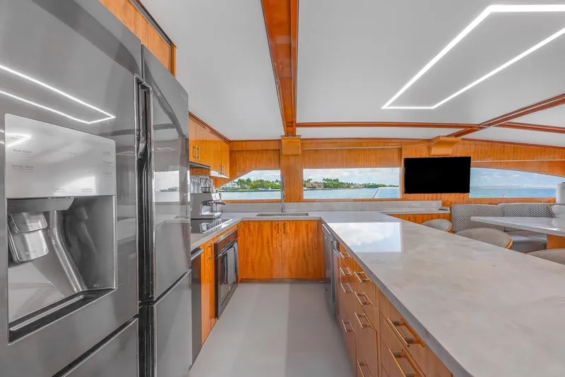 Slide: The Image of Luxurious kitchen interior of 2001 Intermarine RPH 95 yacht with modern appliances and sleek design. - 27