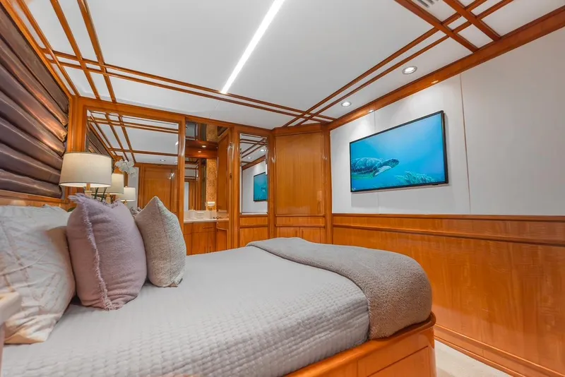 Slide: The Image of Luxurious bedroom interior on 2001 Intermarine RPH 95 yacht with elegant wood paneling. - 34