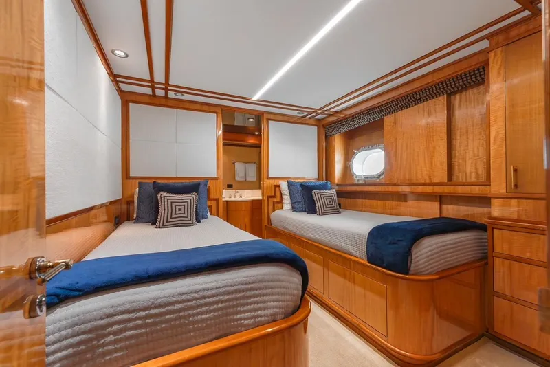 Slide: The Image of Luxurious twin cabin on 2001 Intermarine RPH 95 yacht with elegant wood finish. - 37