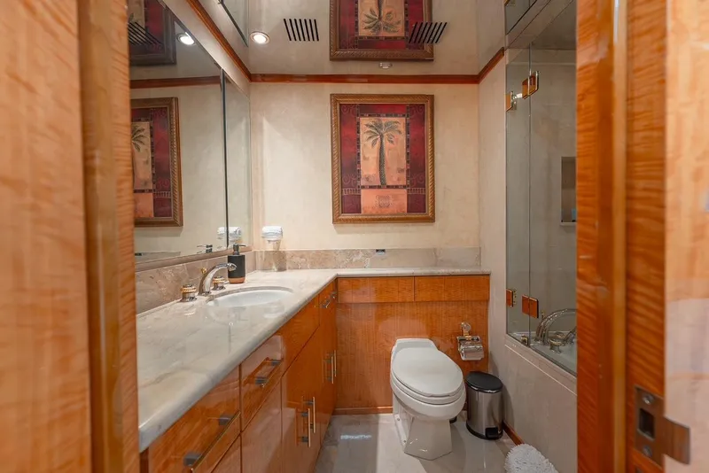 Slide: The Image of Luxurious bathroom in 2001 Intermarine RPH 95 yacht with elegant wood finishes and modern fixtures. - 40