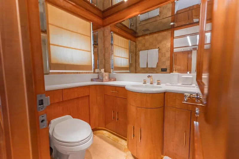 Slide: The Image of Luxurious bathroom in 2001 Intermarine RPH 95 yacht with wooden cabinetry and elegant fixtures. - 44