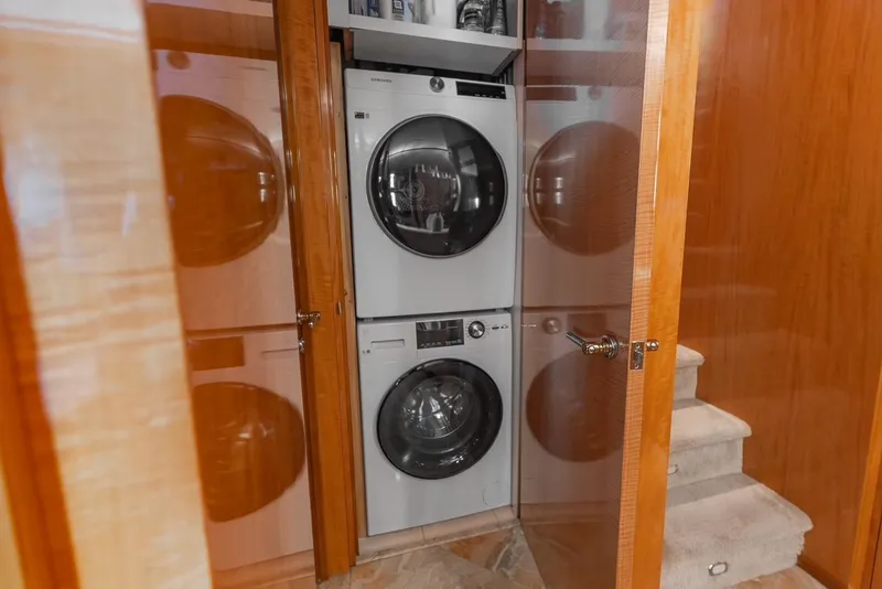 Slide: The Image of Stacked washer and dryer in wooden cabinet on Intermarine RPH 95 yacht, 2001 model. - 45