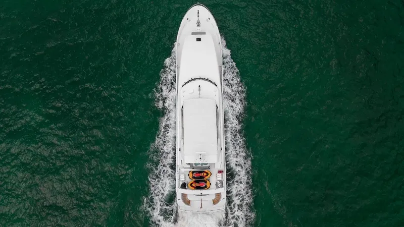 Slide: The Image of Overhead view of 2001 Intermarine RPH 95 yacht cruising on green water. - 6