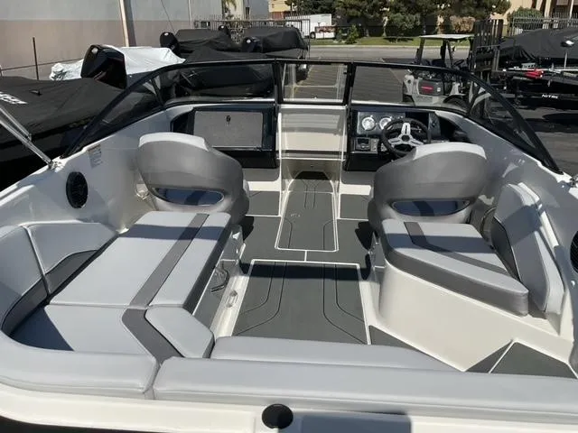 Slide: The Image of 2025 Bayliner V20 boat interior with modern seating and dashboard design. - 11