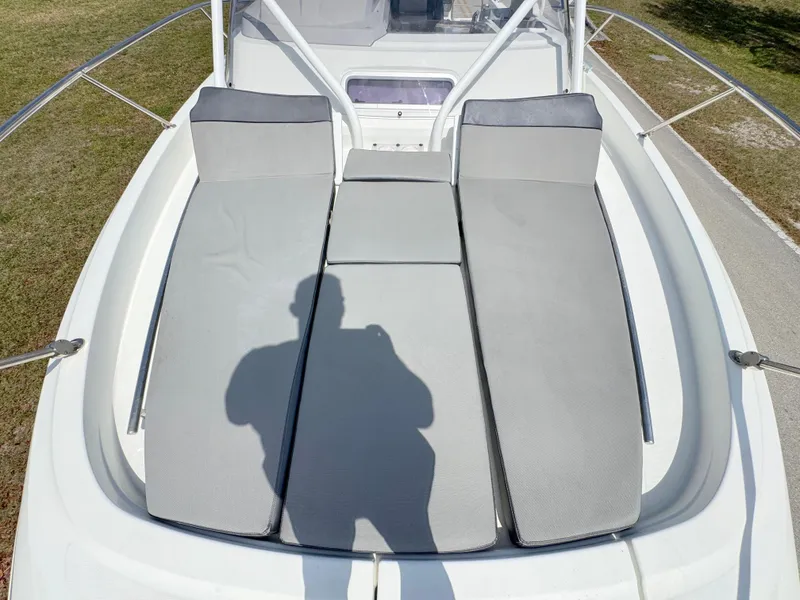 Slide: The Image of 2018 Jeanneau Leader 9.0 WA boat with sunbathing cushions on deck. - 11