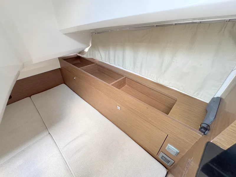 Slide: The Image of 2018 Jeanneau Leader 9.0 WA cabin interior with storage compartments and bedding. - 18