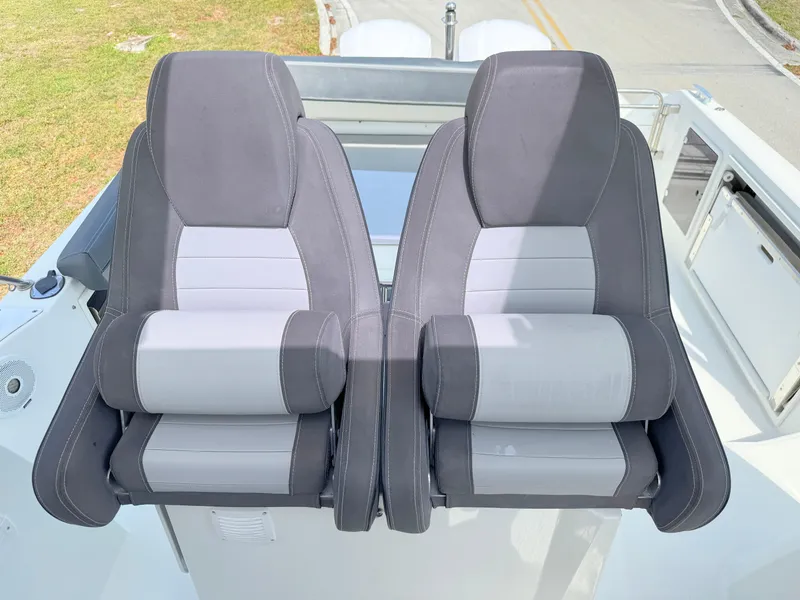 Slide: The Image of Two comfortable seats on a 2018 Jeanneau Leader 9.0 WA boat. - 19