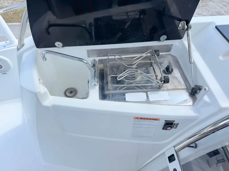 Slide: The Image of Cockpit sink and stove on 2018 Jeanneau Leader 9.0 WA boat. - 24