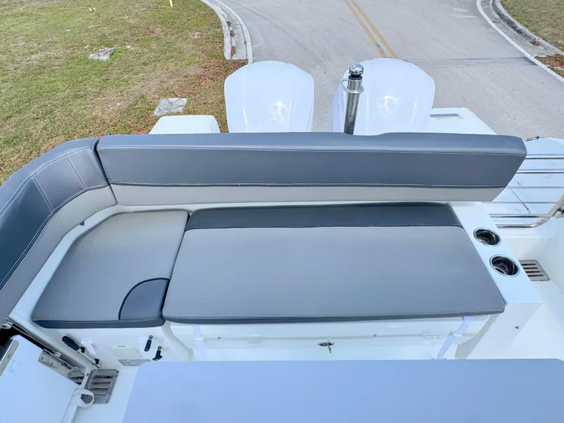 Slide: The Image of 2018 Jeanneau Leader 9.0 WA boat with cushioned seating and dual outboard motors. - 26